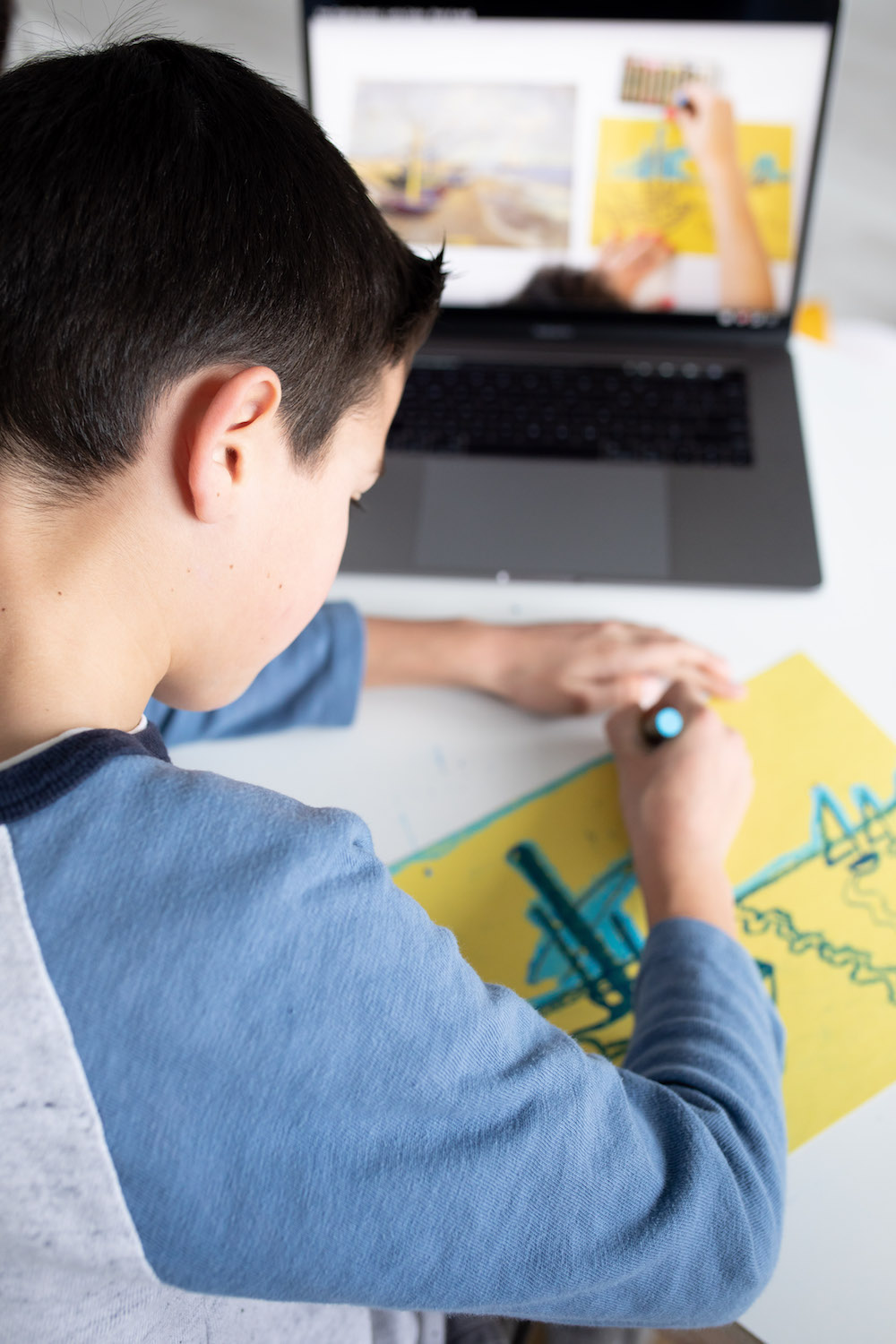 student drawing from digital video